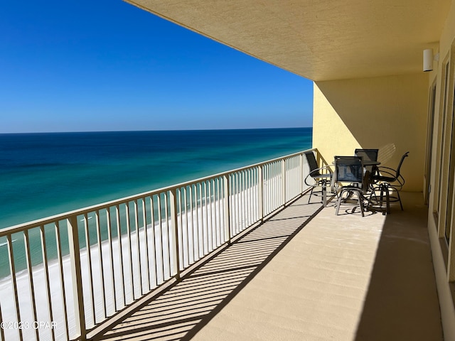 balcony featuring a water view