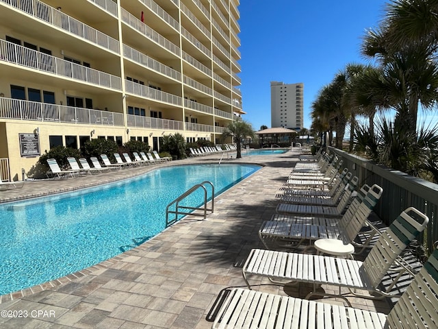 view of swimming pool with a patio