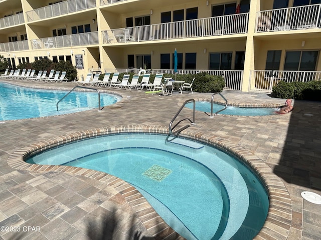 view of swimming pool with a patio