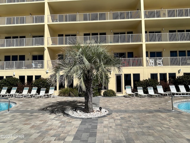 view of property featuring a community pool