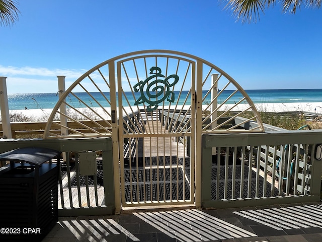 exterior space with a water view and a view of the beach