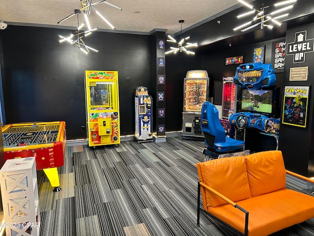 recreation room with an inviting chandelier, a textured ceiling, and dark carpet