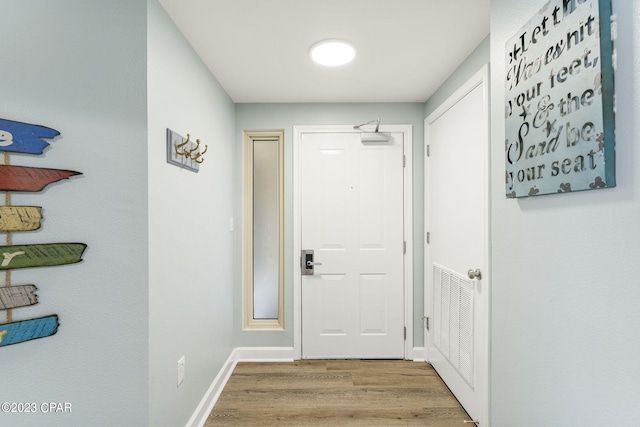 entryway with light hardwood / wood-style floors