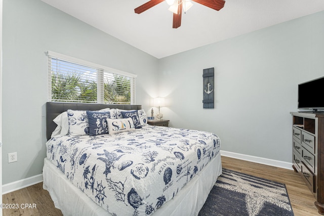 bedroom with wood-type flooring and ceiling fan