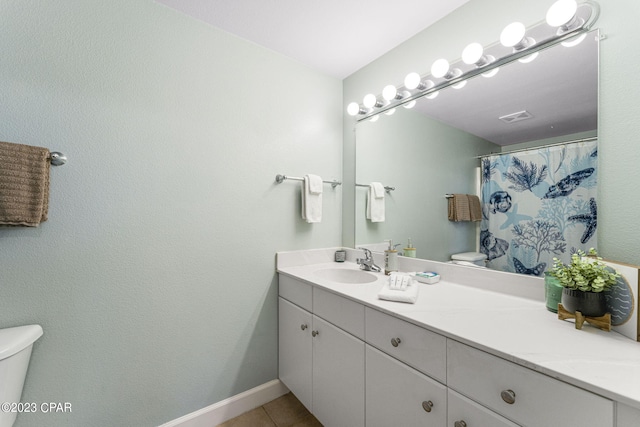 bathroom featuring tile patterned floors, vanity, toilet, and a shower with shower curtain