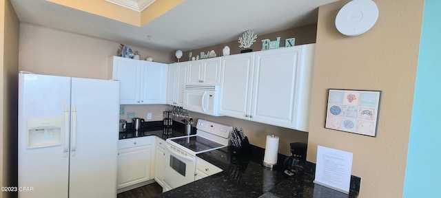 kitchen with white appliances and white cabinetry