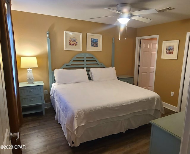 bedroom with ceiling fan and dark hardwood / wood-style flooring