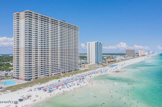 exterior space featuring a beach view and a water view