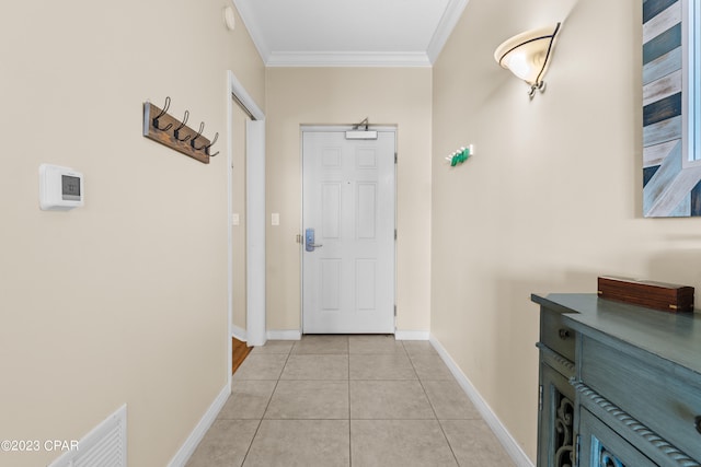 doorway featuring ornamental molding and light tile patterned flooring