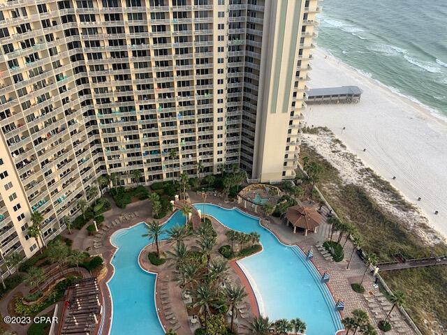 exterior space with a water view and a view of the beach