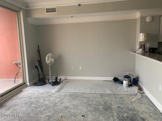 interior space with crown molding