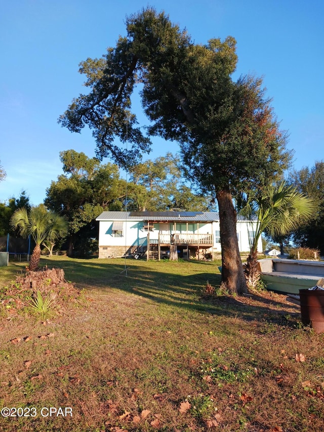 view of yard with a wooden deck