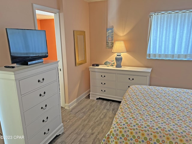 bedroom featuring light wood-type flooring