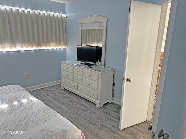 bedroom with light hardwood / wood-style floors