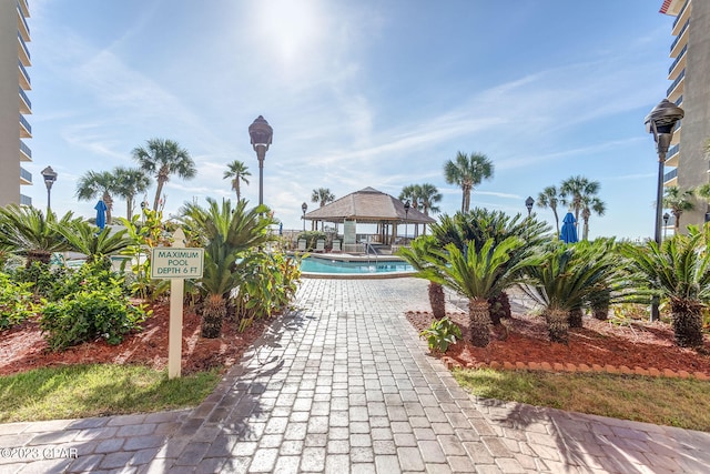 view of property's community featuring a gazebo and a swimming pool