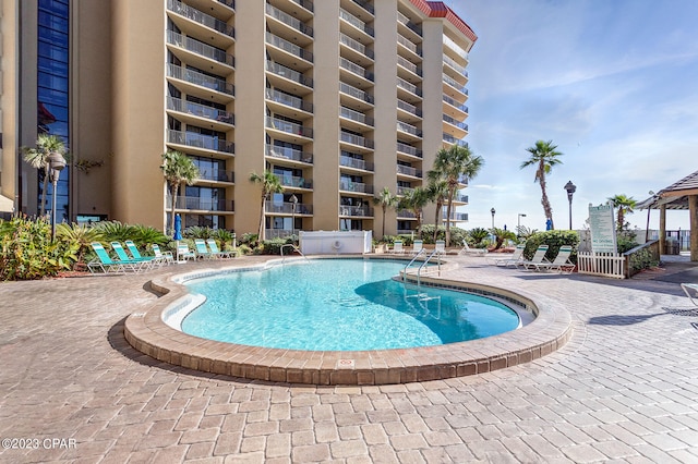 view of swimming pool featuring a patio