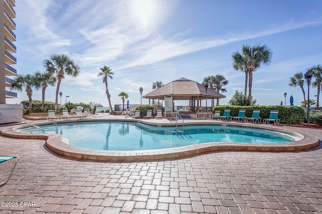 view of swimming pool featuring a gazebo and a patio