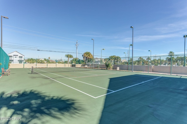 view of tennis court featuring basketball court