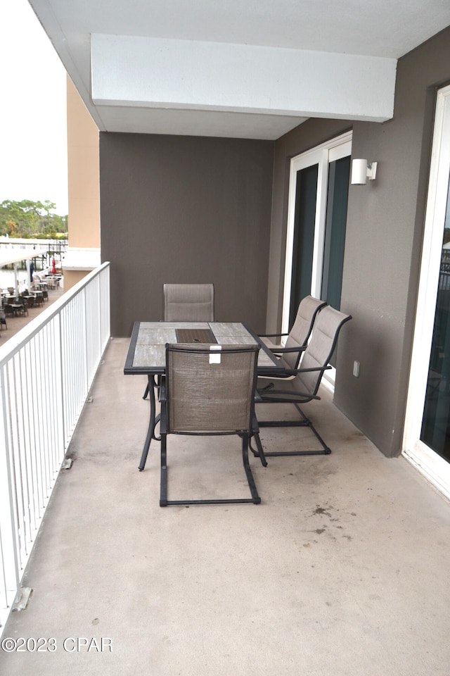 balcony featuring outdoor dining space