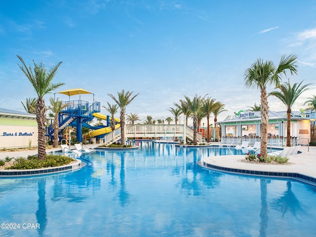 view of swimming pool featuring a water slide