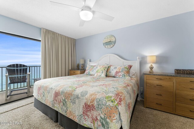 bedroom featuring light carpet, multiple windows, and ceiling fan