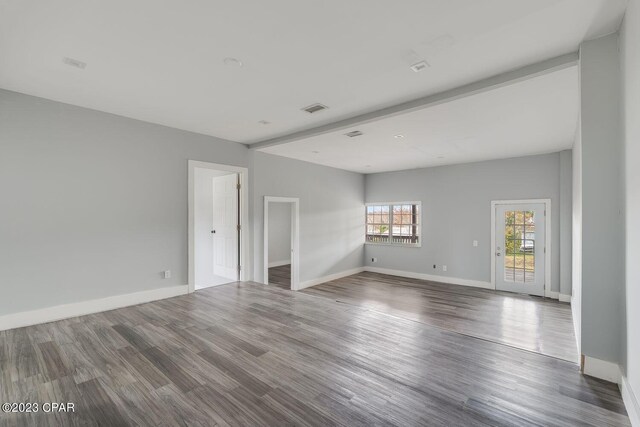 spare room featuring dark hardwood / wood-style flooring