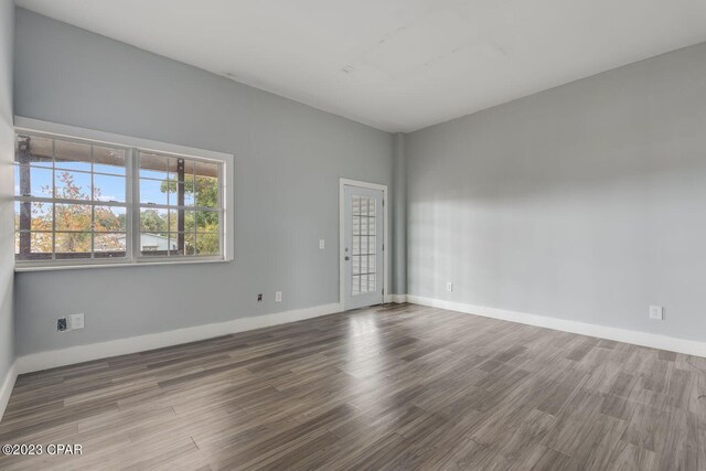 empty room with wood-type flooring