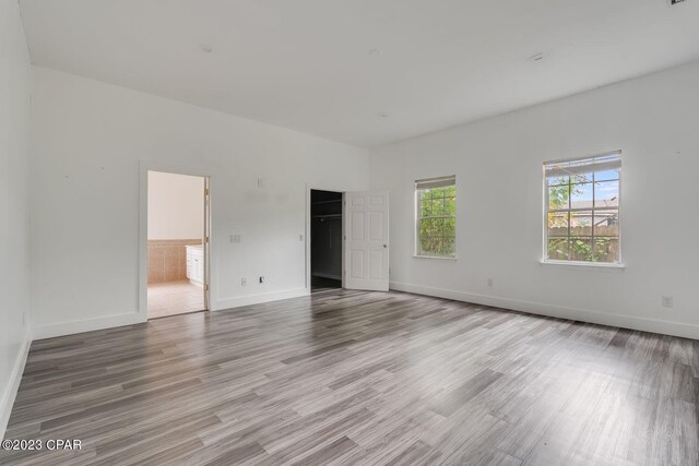 unfurnished room with hardwood / wood-style floors