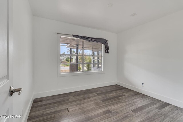 empty room featuring hardwood / wood-style flooring