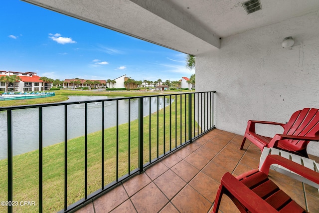 balcony featuring a water view