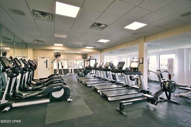 exercise room with a drop ceiling