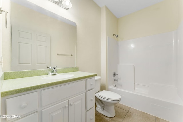 full bathroom featuring tile patterned floors, vanity, toilet, and shower / washtub combination