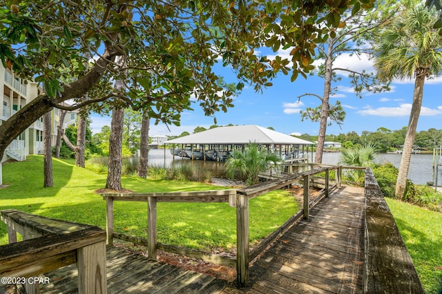 exterior space with a lawn and a water view