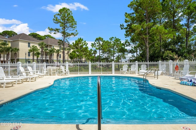 view of swimming pool with a patio area