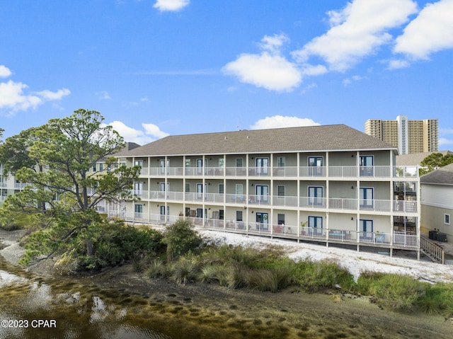 view of building exterior with a water view