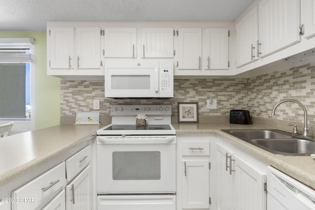 kitchen featuring sink, a textured ceiling, white appliances, decorative backsplash, and white cabinets