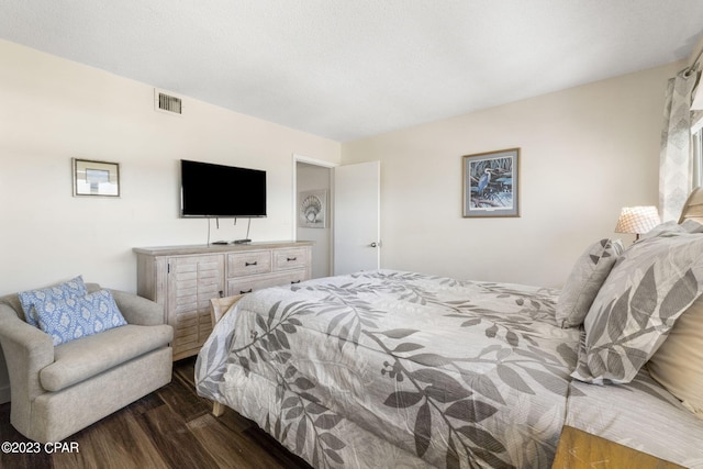 bedroom featuring dark wood-type flooring