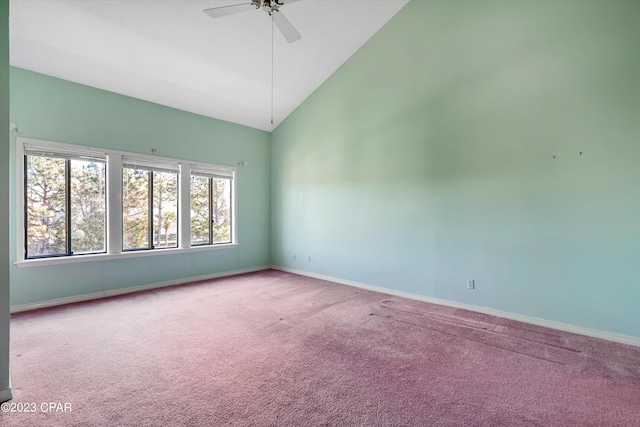 empty room featuring carpet, ceiling fan, and high vaulted ceiling