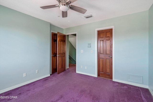 unfurnished bedroom featuring carpet and ceiling fan