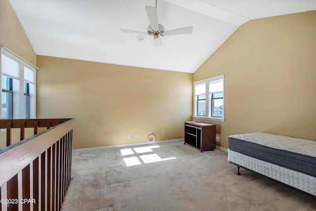 carpeted bedroom featuring vaulted ceiling and ceiling fan