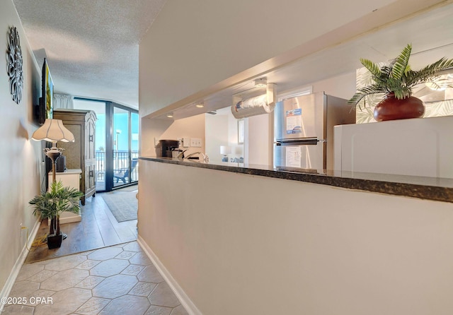 9850 S Thomas Dr Unit 211E, Panama City Beach, FL 32408 - reception with expansive windows and a textured ceiling