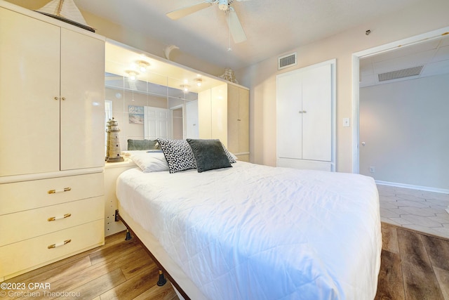 bedroom featuring ceiling fan and hardwood / wood-style floors