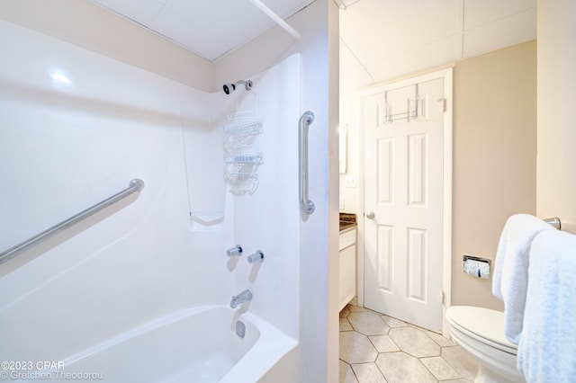 full bathroom featuring vanity, washtub / shower combination, toilet, and tile patterned flooring