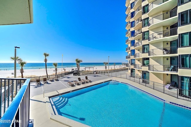9850 S Thomas Dr Unit 211E, Panama City Beach, FL 32408 - community pool with view of water and beach and a patio