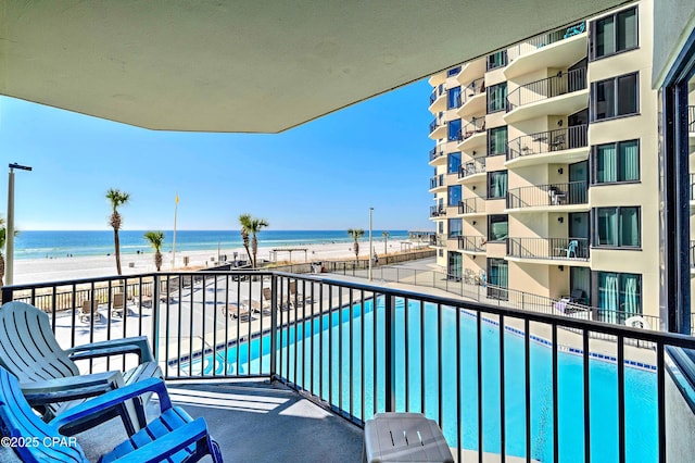 9850 S Thomas Dr Unit 211E, Panama City Beach, FL 32408 - balcony with view of water and beach and view of pool area
