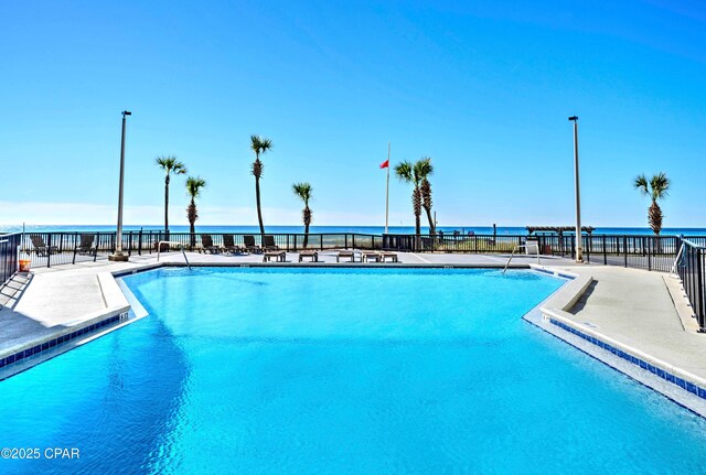 9850 S Thomas Dr Unit 211E, Panama City Beach, FL 32408 - community pool featuring a water view and a patio