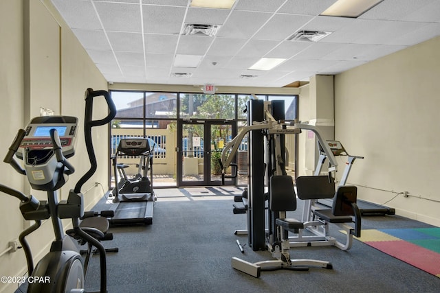 workout area featuring a drop ceiling