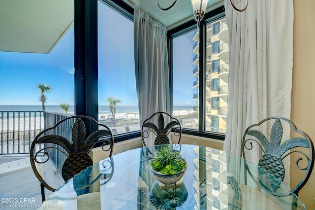 dining area with a healthy amount of sunlight and a water view