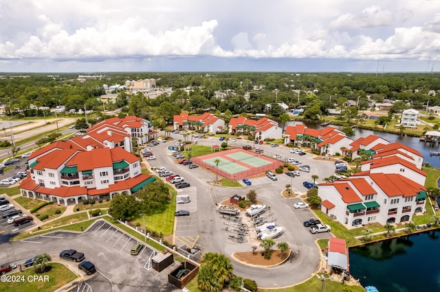 bird's eye view featuring a residential view and a water view