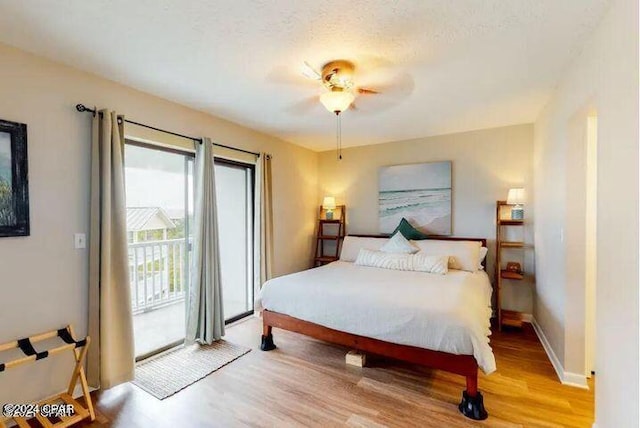 bedroom with access to exterior, ceiling fan, and light wood-type flooring